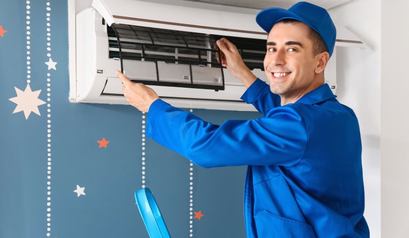 Man fixing air conditioning - How to make a website for an air conditioning contractor